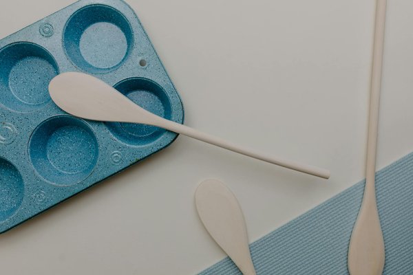 How can vertical storage be optimized in a slim UK kitchen layout?